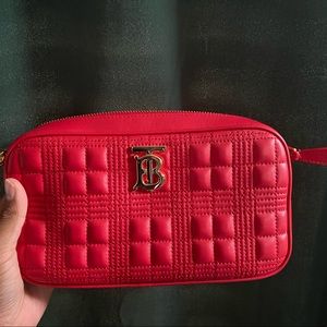 Burberry London, never worn, new with tags. 
Red leather quilted check handbag